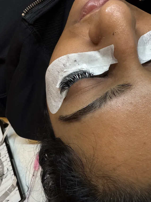 Lash extensions being applied over a gel pad